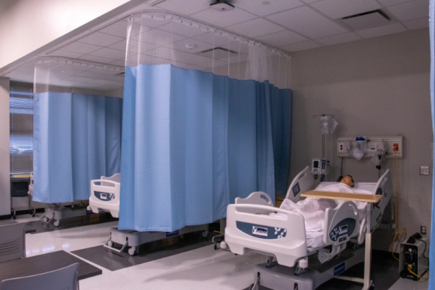 The state-of-the-art mannequins in the healthcare suite at John Marshall Enterprise High School's college and career center can talk to students as they practice caring for a patient.
