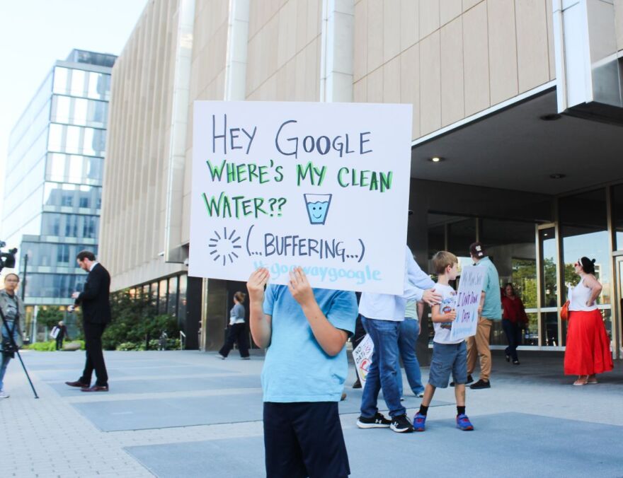 A child holds a sign with the phrase, “Go away Google,” which protestors chanted outside the City-County Building in Downtown Indianapolis on Monday, Sept. 8, 2025. 