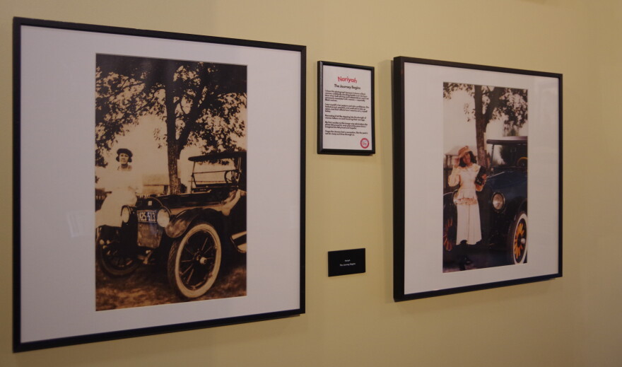 A woman in the early 20th century stands on the fender of what appears to be a 1915 Buick Model C-37. To the right hangs its modern-day recreation, featuring a Merze Tate Explorer in period accurate clothing, makeup and hair styling.
