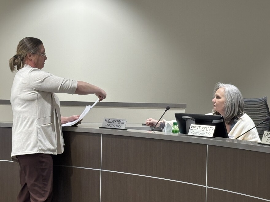 Addie Best presents materials for the Itasca County Board at the Board's meeting May 5, 2026, in Grand Rapids.
