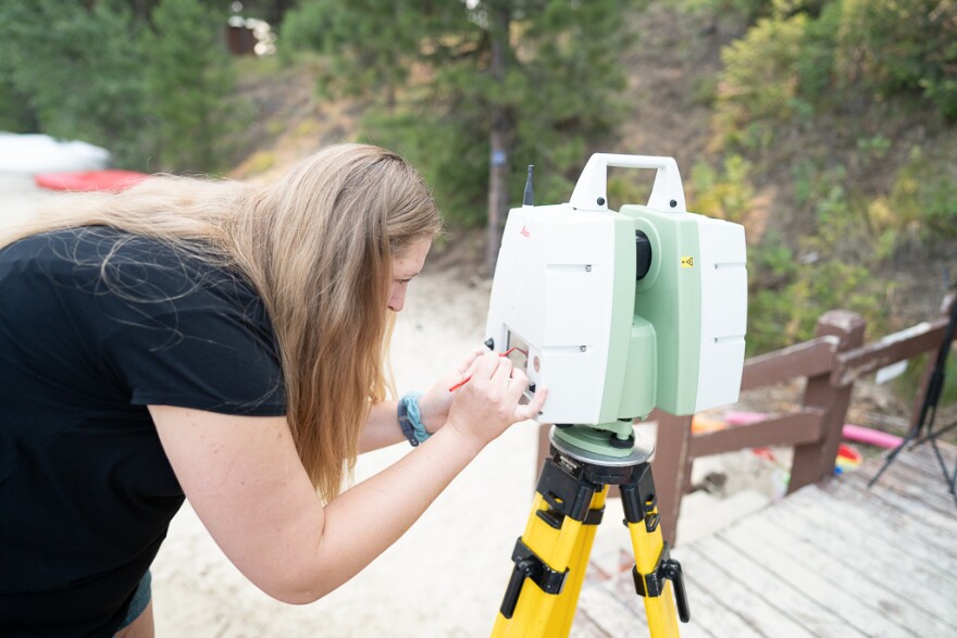 University of Idaho graduate student Heather Crawford demonstrates how she uses a terrestrial laser scanner to test for erosion that may be occurring on the Payette Lake's shoreline. Erosion can cause disruptions to water quality over time. Crawford is from McCall and hopes to return to her hometown to work in water quality after graduating in May 2022.