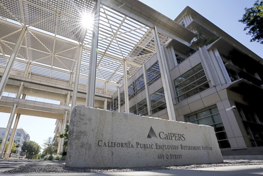 The suns peaks over the California Public Employees Retirement System's building in Sacramento.