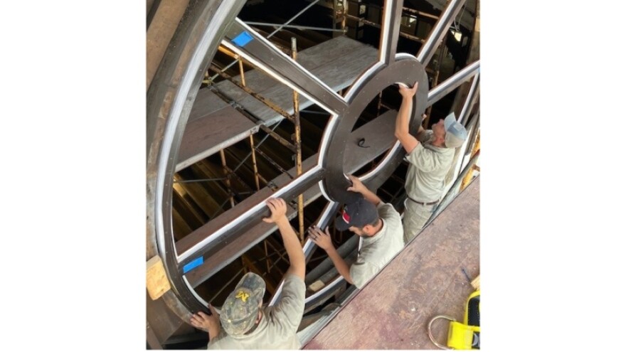 Grand River Builders crew fits round window frames into Hermitage at Diamon