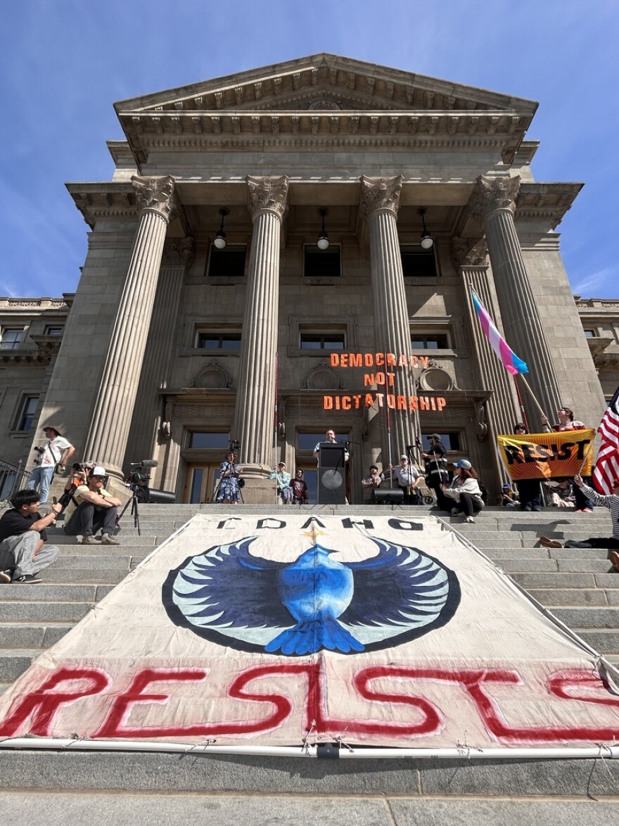 An “Idaho Resists” banner drapes the stairs of the Statehouse in Boise during the city’s third No Kings protest on Saturday, March 28, 2026. (Photo by Christina Lords/Idaho Capital Sun)