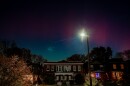 The aurora borealis glows over St. Louis’ Shaw neighborhood in this long exposure photograph during the waning hours of Tuesday, Nov. 11, 2025, in St. Louis, Missouri.
