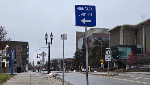Lansing street with sign that says "food scrap drop off"