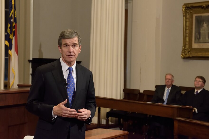 Gov. Roy Cooper vetoed one voting bill and signed another.
