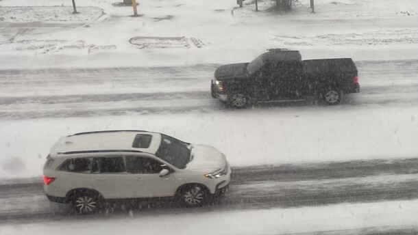 Cars navigate State Street on Monday, Dec. 29, 2025, as snow blows, affecting visibility.