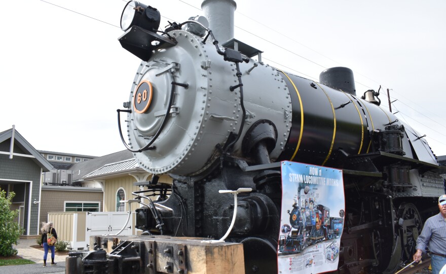 Steam engine number 60 is a black and grey locomotive with the number 60 embossed in gold on its front. It's on display in Lewes.
