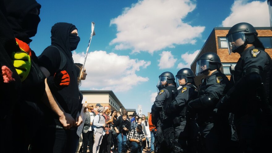 Counter-protestors block off the esplanade on Kent State's campus, preventing open-carry demonstrators to pass through on September 29, 2018. 