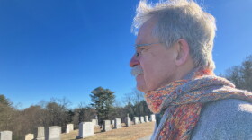 Terry McKiernan, president of BishopAccountability.org, visits a cemetery in Douglas where Phil Saviano is buried. Saviano was a board member of BishopAccountability.org and a