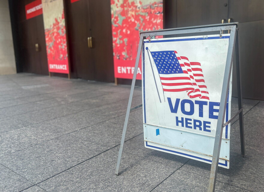A "Vote Here" directs voters into the National WWl Museum & Memorial on August 4, 2026.