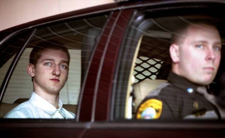Robert Tulloch, left, leaves the Grafton County courthouse in North Haverhill, N.H., following a hearing in 2001.