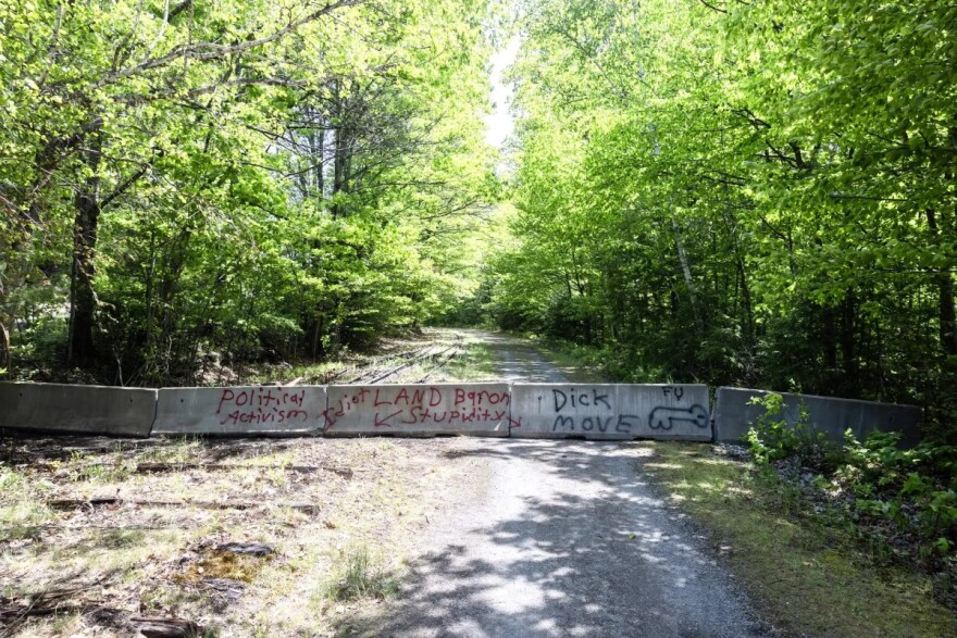 Graffiti covers the concrete barriers on the Andover section of the Rail Trail near Potter Place.