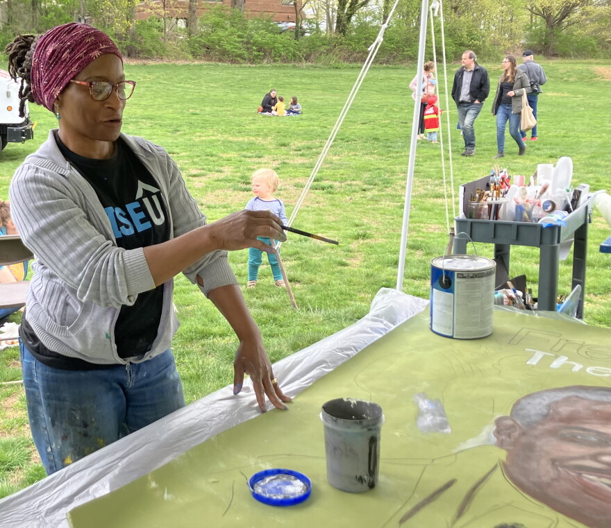 Emida Roller, a mural artist who is a member of the community organization Rise Up for Arts.