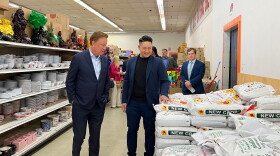 Gov. Ned Lamont talks with store manager Jimmy Tran as he tours A Dong Supermarket in West Hartford on Tuesday, May 9, before a press conference there to promote his plan to cut income tax rates for low- and middle-income earners. Tran said he supports the governor's tax plan because it would mean his customers would have more money to spend.