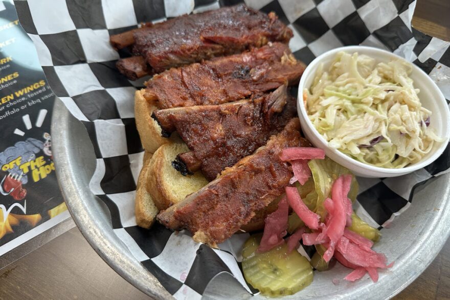 A plate of ribs and coleslaw from Off the Hook BBQ.