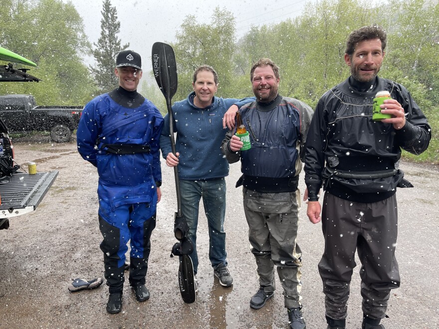 Auden Schendler, right, celebrates with fellow paddlers after running a river during a wet year. Photo courtesy of Auden Schendler.