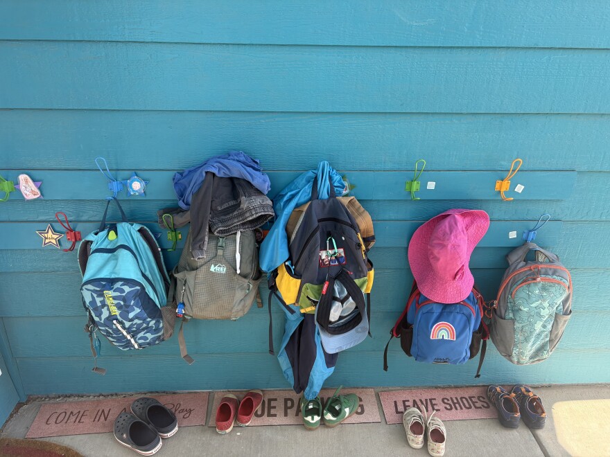 Kids’ backpacks hang outside Thompson Schoolhouse, an in-home day care run by Ali Cottle in Carbondale on July 10, 2025.