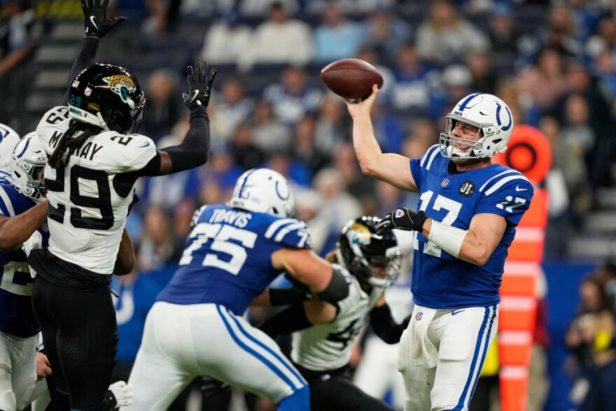 Indianapolis Colts quarterback Philip Rivers (17) throws under pressure from Jacksonville Jaguars safety Eric Murray (29) during the second half of an NFL football game Sunday, Dec. 28, 2025, in Indianapolis.