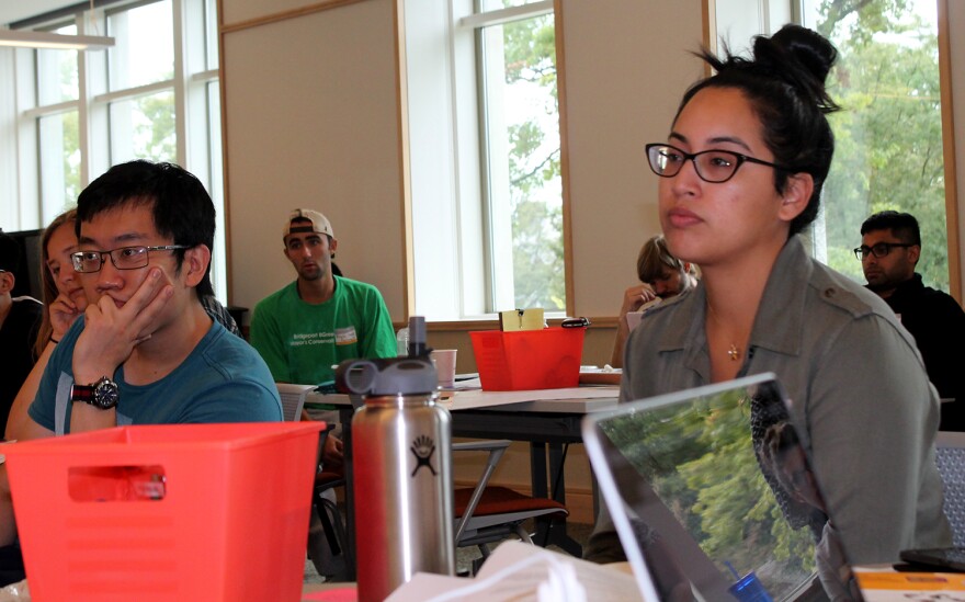 Christina Arzate, right, listens to a panel of community mentors talk about gun violence Saturday, Sept. 17, 2016.