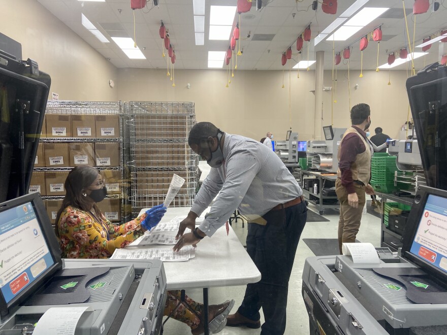 Election workers process vote-by-mail ballots Tuesday afternoon Nov. 3, 2020 at the Broward County Supervisor of Elections Office in Lauderhill.