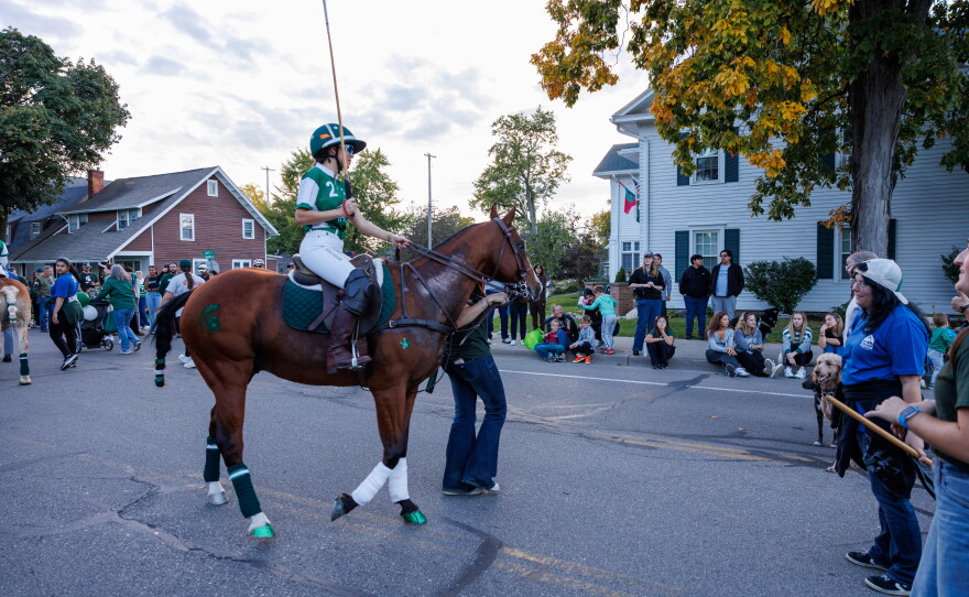 Members of the Michigan State University Polo Club ride horses in the Michigan State University Homecoming Parade in East Lansing, Mich., on Oct. 9, 2026.