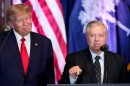 FILE - Former President Donald Trump listens as Sen. Lindsey Graham, R-S.C., speaks at a campaign event at the South Carolina Statehouse, Jan. 28, 2023, in Columbia, S.C. (AP Photo/Alex Brandon, File)