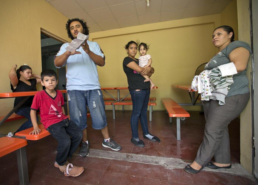 Menelio Briones, 32, along with his wife, Marinelis Sabillón, 33, and their five children arrive at the El Edén center in San Pedro Sula, Honduras. They were attempting to reach the U.S., but were picked up in Mexico and deported.