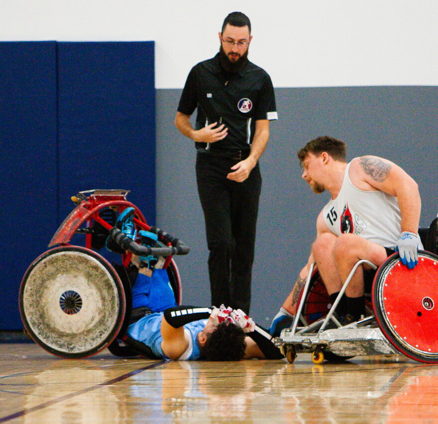 Wreckers' player Connor Herbst (right) leans toward Zayne Hammoudeh from Akron, OH, who is laying on the ground at Pinnacle Athletic Campus in Victor, NY, during a 2024 tournament.