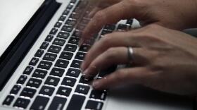 A person working on a laptop in North Andover, Massachusetts. (Elise Amendola/AP)