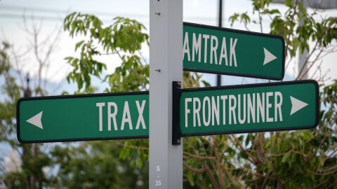 Signage pointing to Amtrak, UTA’s FrontRunner and TRAX lines at Salt Lake Central Station, Aug. 12, 2026. Transit advocates hope a planned expansion of the FrontRunner system will lead to increased demand and ultimately more ambitious transit projects in the coming years.
