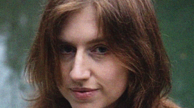 a film shot of katie myers on a blue background 