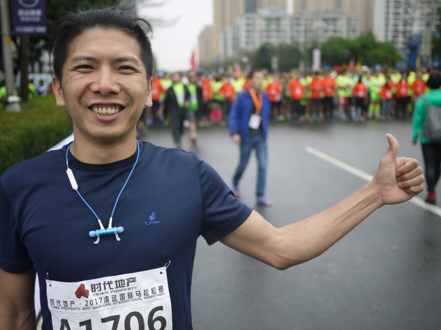 Runner Xu Ting, just before starting his first full marathon, in Qingyuan, China, says he's prepared a long time for this race — even suspending his two-pack-a-day smoking habit for five days in the hope of running faster.
