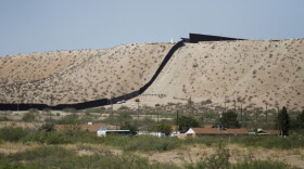 Border Patrol vehicles survey a steel fence at the Southwest border with Mexico at Sunland Park, N.M., Thursday, Aug. 22, 2024. (AP Photo/Morgan Lee, File)