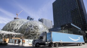 An Amazon Prime truck delivers an Australian fern to Amazon's campus for the ceremonial first planting at The Spheres on Thursday,  May 4, 2017, in Seattle.