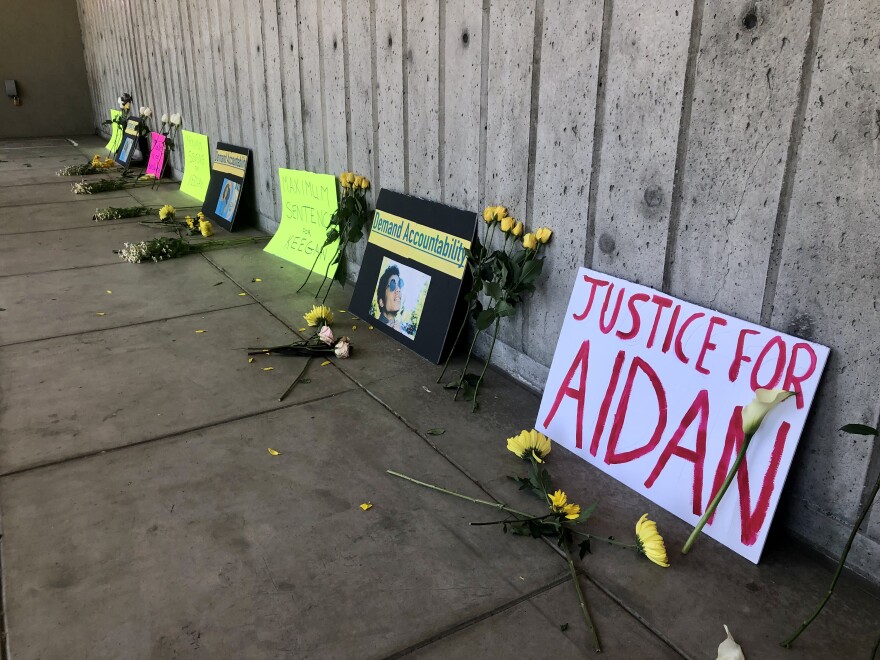 Protestors brought signs and flowers on Friday to demand justice for Aidan Ellison.