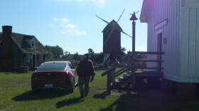 George Radcliffe walks toward the windmill on the Spocott property.