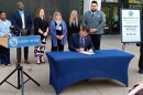 Erie County Executive Mark Poloncarz signs the county's new biometric privacy law into effect during a ceremony outside the Rath Building, Tuesday, May 26, 2026.