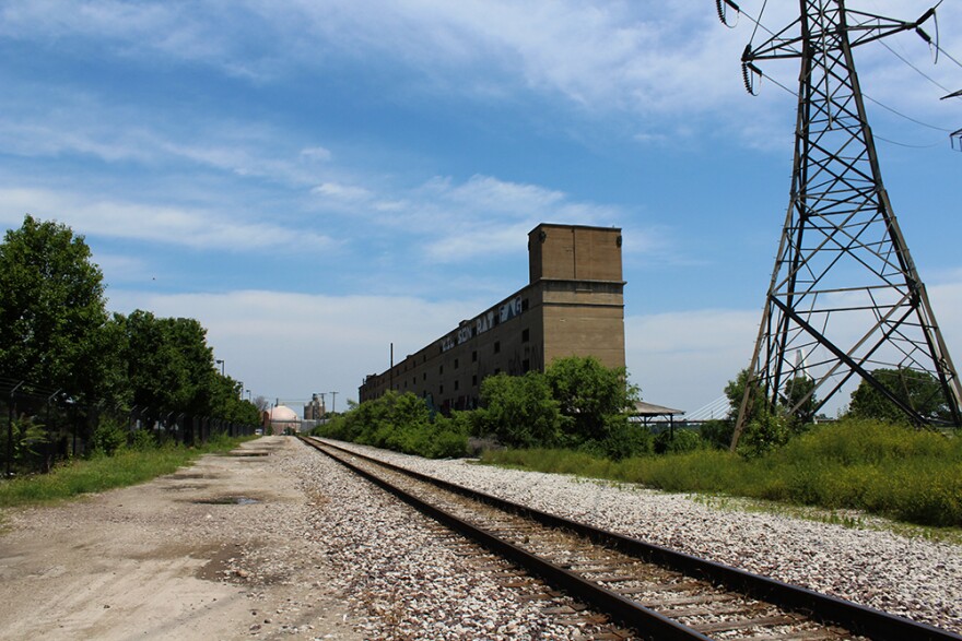 Train tracks running parallel to the Cotton Belt Depot.