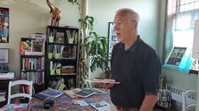 Rick Brooks talking to one of his partners inside his office at the Princeton Amtrak Station