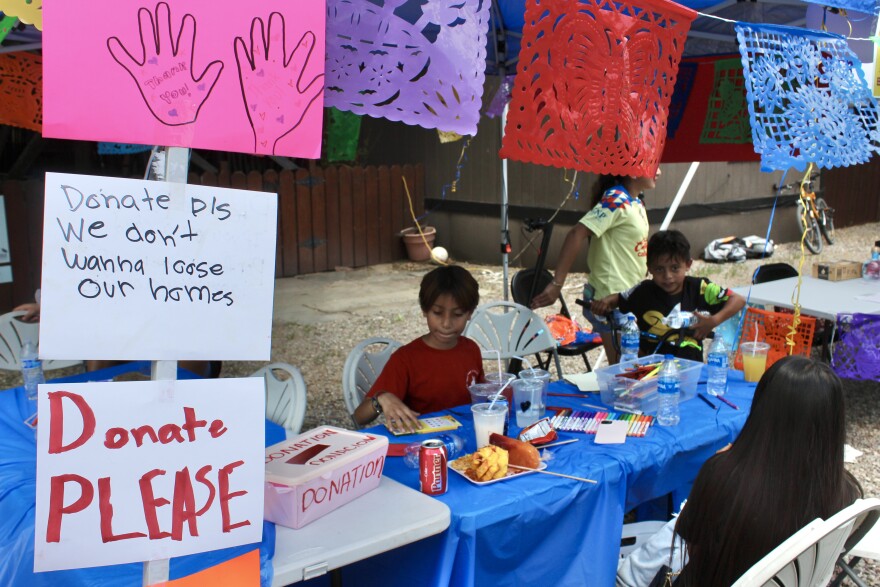 Kids at the Mountain Valley Mobile Home Park in Carbondale write “thank you” cards for people who donated at a June 28 fundraiser to help residents buy the land under their homes from the park’s owner, Utah-based company Investment Property Group. The company is selling the park, along with the Aspen-Basalt Mobile Home Park near Willits, for a combined price of $42 million.