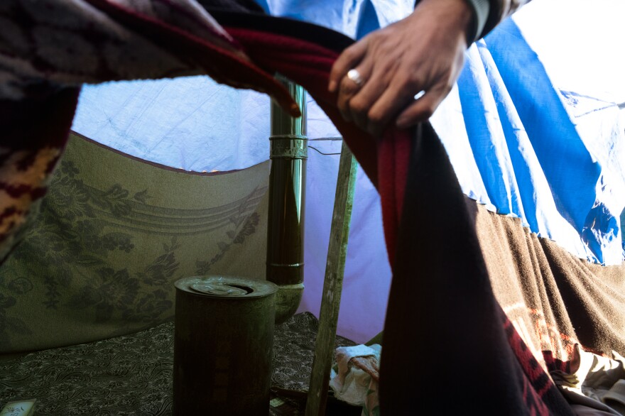 Mustafa Kader shows the setup inside one of the tents in Gaziantep.