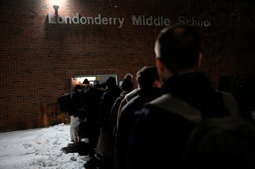 People wait in the cold to see former mayor of South Bend, Indiana Pete Buttigieg speak at his town hall meeting at Londonderry Middle School on Feb. 9.