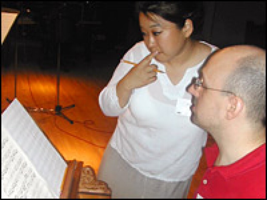 Harpsichord player Joseph Gascho and soprano Ah Hong prepare to perform music not heard for nearly 300 years.