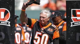 Former Cincinnati Bengals quarterback John Stofa waves to the crowd during a halftime 50th anniversary ceremony of an NFL football game against the Baltimore Ravens, Sunday, Sept. 10, 2017, in Cincinnati.
