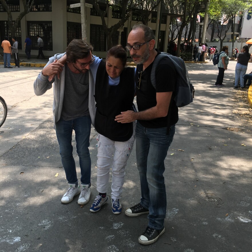 Men help a woman injured in Mexico City during the earthquake on Tuesday.
