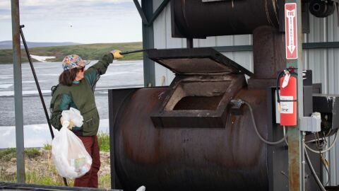 Sally Anderson incinerates garbage at Toolik Field Station on June 25, 2026.