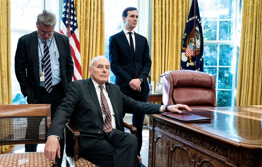 White House communications official Bill Shine (left), then-White House chief of staff John Kelly and senior adviser Jared Kushner wait in the Oval Office in December 2018. <em>The New York Times</em> reports that Kelly opposed Kushner's security clearance, but President Trump overruled him and others.