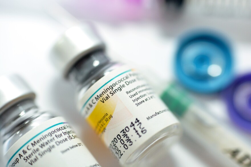 Close-up photo of two meningococcal vaccine vials. 